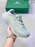 Pale mint Lacoste lace-up sneaker with patterned upper and green shoebox