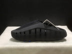 Side profile showing the closed toe, perforated sidewall, and sculpted sole construction.