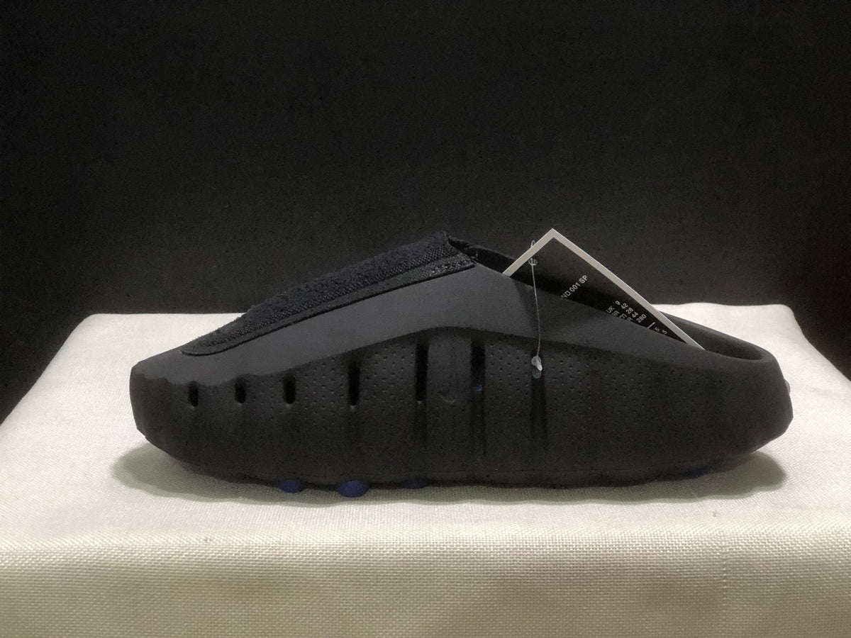 Side profile showing the closed toe, perforated sidewall, and sculpted sole construction.