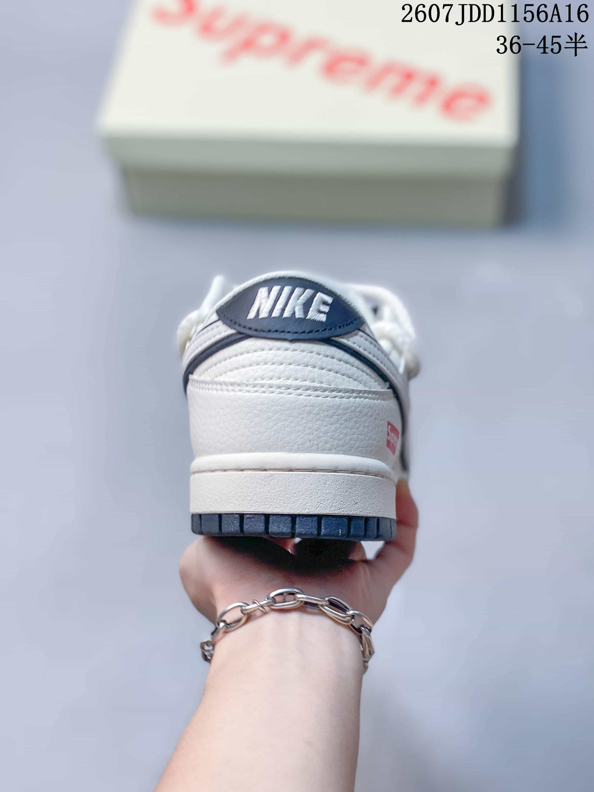 Rear view of an off-white sneaker showing the Nike tongue branding, layered heel construction and dark outsole.