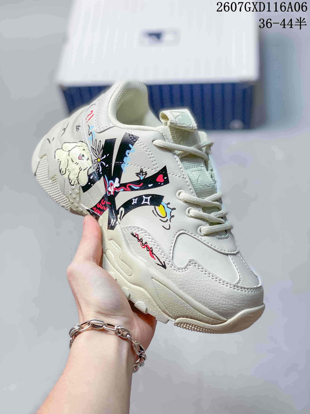 Angled side view showing the colorful doodle dog artwork and graphic panels on the cream beige sneaker.