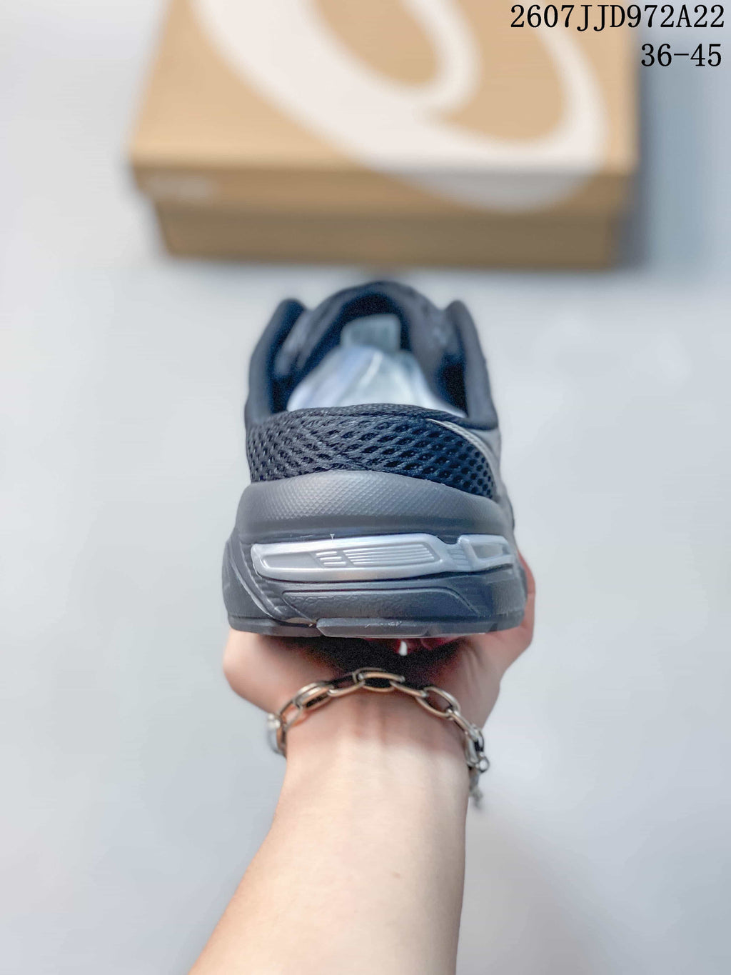 Rear view of the sneaker showing the padded heel area and layered outsole.