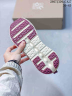 Underside view showing the white and burgundy segmented outsole pattern.