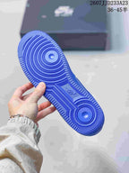 Blue rubber outsole of the sneaker showing circular and linear traction patterns.