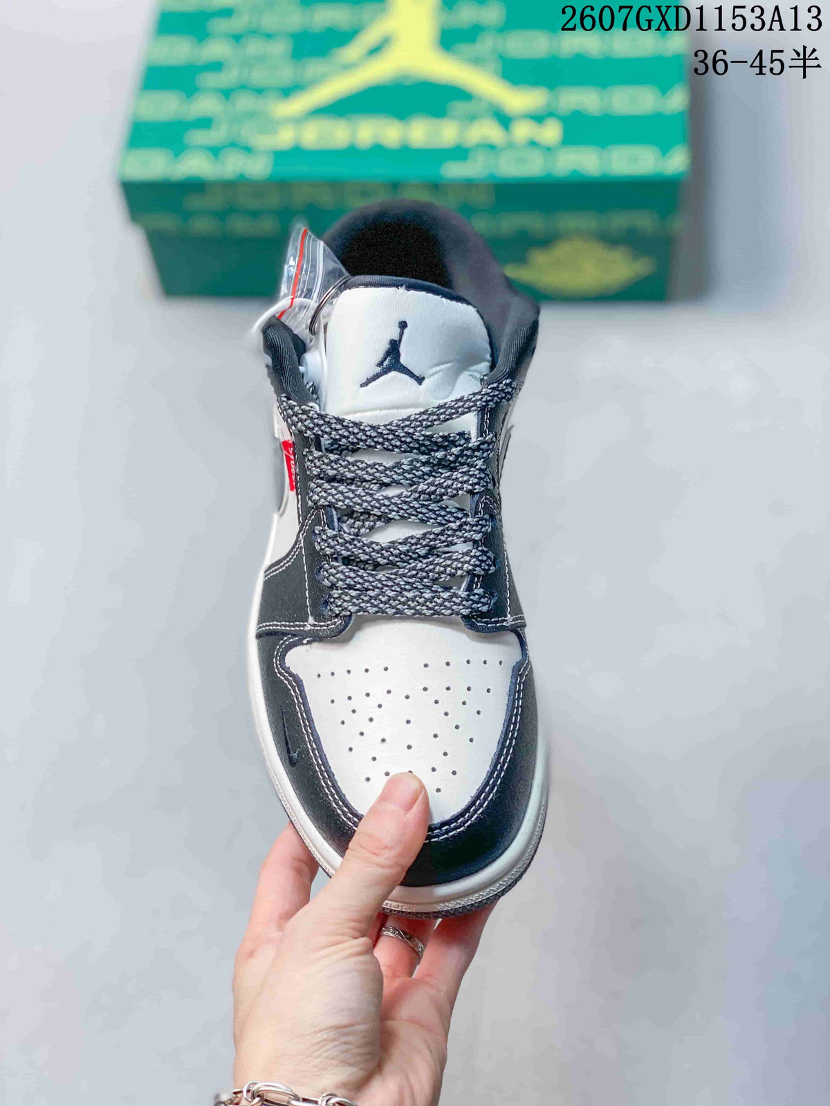 Top view showing the perforated white toe box, dark overlays and patterned laces.
