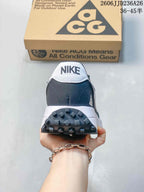 Rear view showing the white Nike heel tab, dark gray heel panel, and textured outsole.