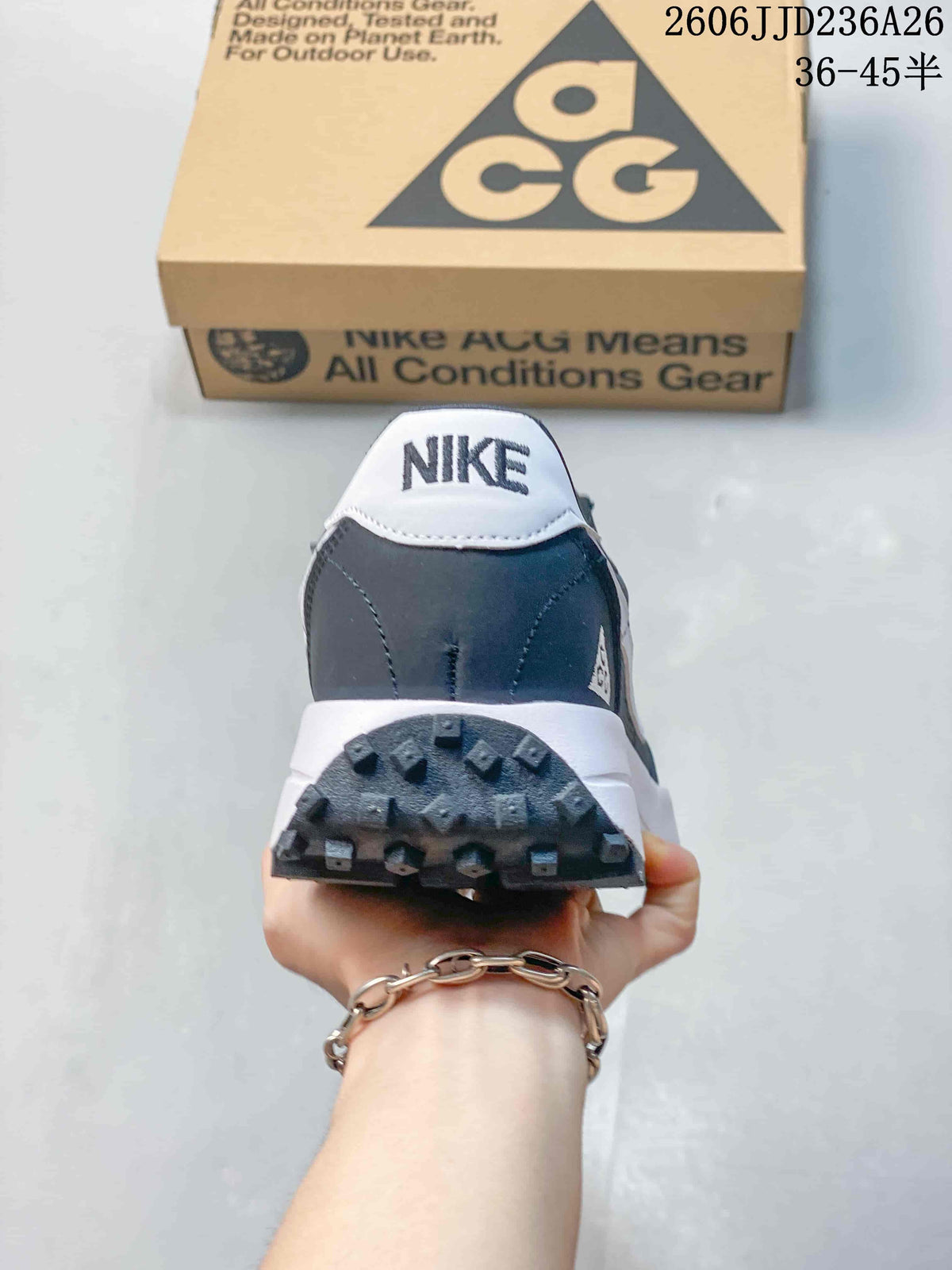 Rear view showing the white Nike heel tab, dark gray heel panel, and textured outsole.