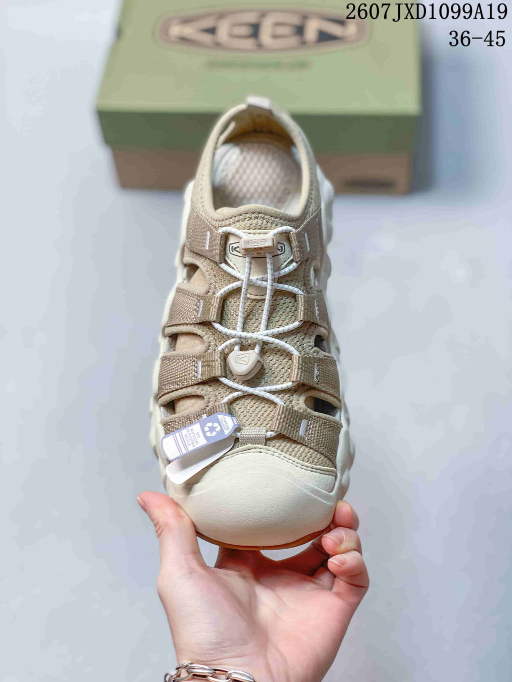 Top view of the sandal showing the toe guard, webbing straps, toggle-style lacing, and padded footbed.