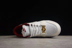 Top view of one sneaker showing the perforated toe box, laces, layered overlays, and gold-tone clasp.