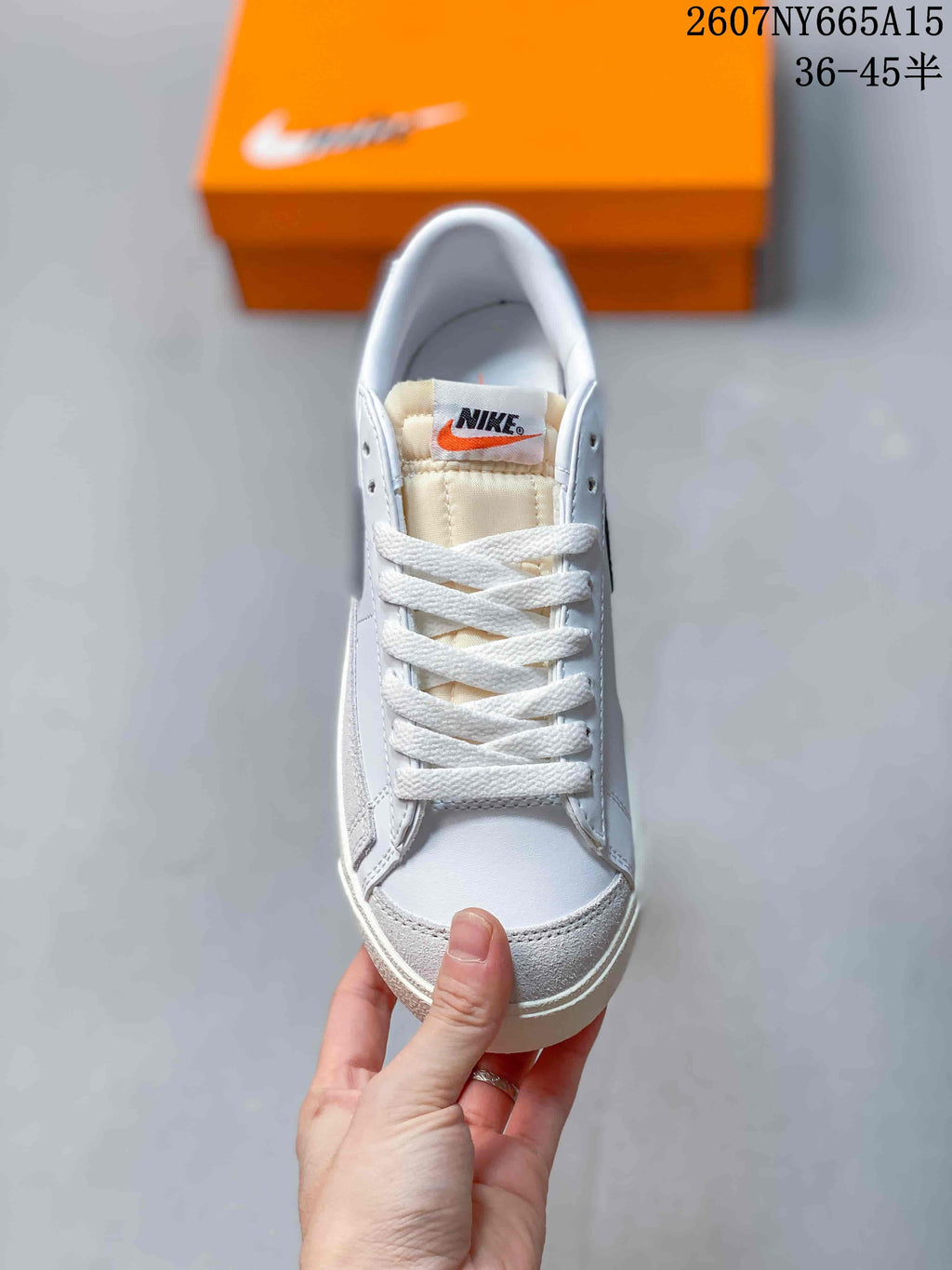 Top view showing the white laces, padded tongue and toe box.
