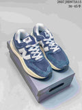 Pair of navy and white New Balance 5740 sneakers displayed on a shoebox.