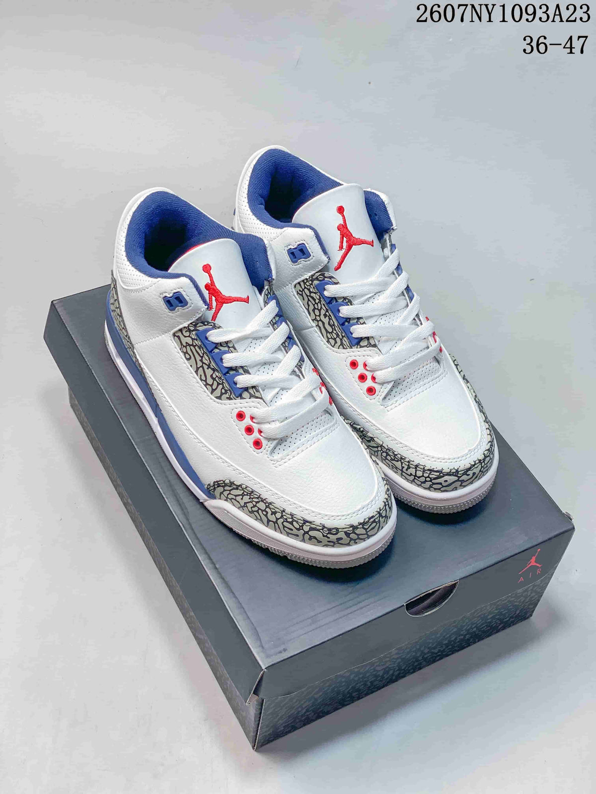 Pair of white, blue, and red Jordan Air Jordan 3 Retro sneakers displayed on a Jordan shoebox; product code 2607NY1093A23 and size range 36–47 are visible.