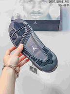 Close view of the patterned outsole on a dark sneaker