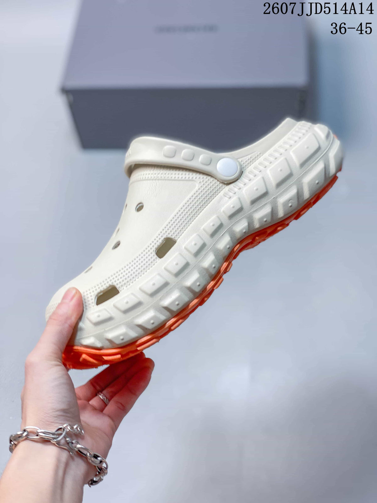 Side view of the off-white clog sandal showing the perforated upper, adjustable heel strap, and chunky layered sole.