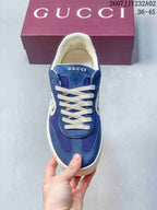 Top view of a blue low-top sneaker with white laces and mesh panels