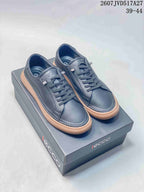 Pair of dark navy ECCO low-top sneakers displayed on an ECCO shoebox, with style code 2607JVD517A27 and size range 39–44 visible.