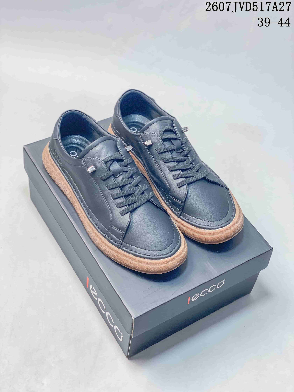 Pair of dark navy ECCO low-top sneakers displayed on an ECCO shoebox, with style code 2607JVD517A27 and size range 39–44 visible.