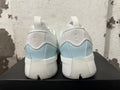 Rear view of white and light blue Adidas Dame 9 shoes