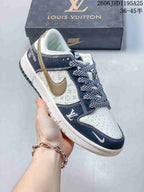 Close view of a white and navy monogram-print low-top sneaker with a contrasting Swoosh and patterned laces.