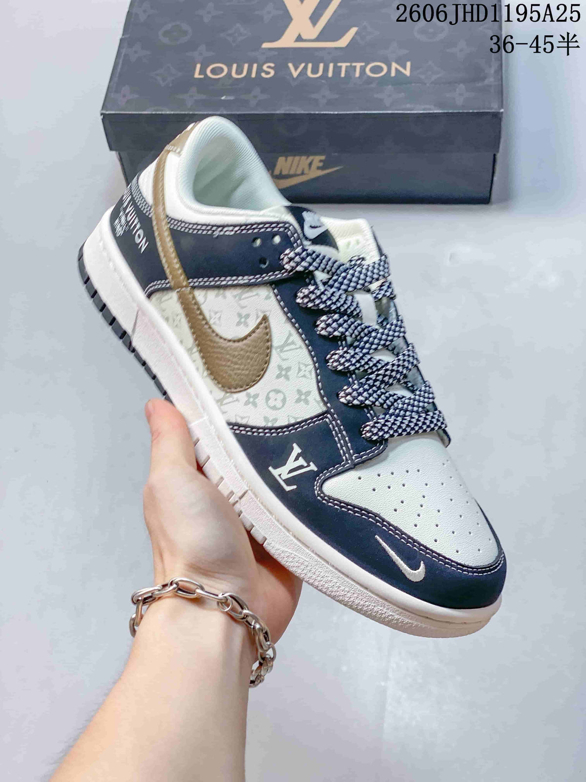 Close view of a white and navy monogram-print low-top sneaker with a contrasting Swoosh and patterned laces.