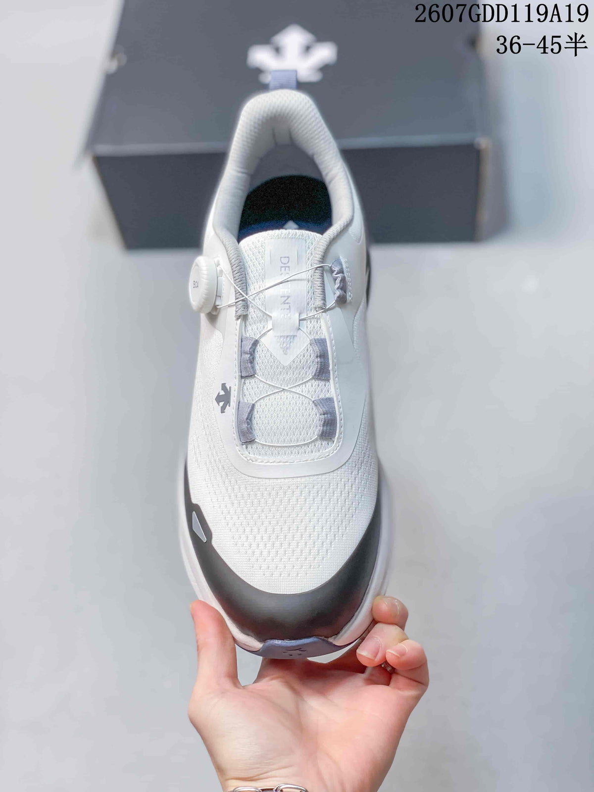 Top view of the white shoe showing the mesh-textured toe, gray cable lacing, BOA-style dial, and padded collar.
