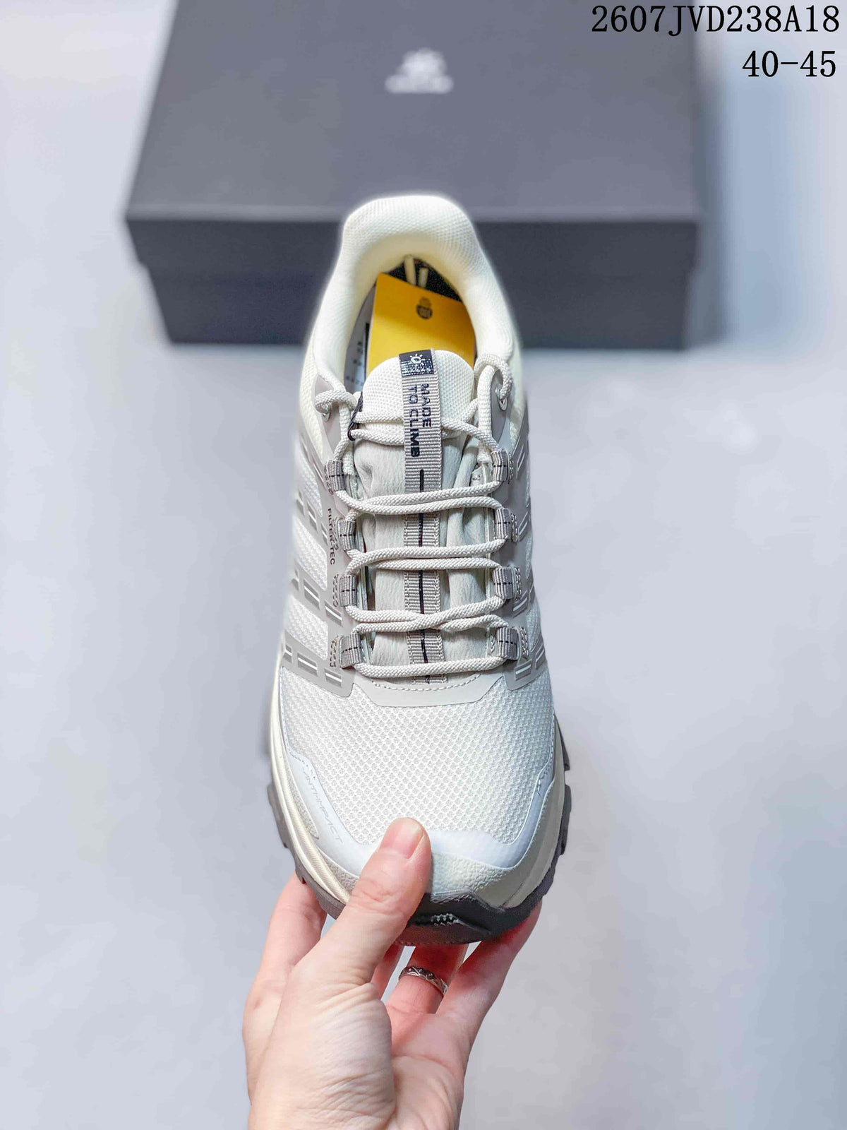 Top view of the hiking shoe showing the mesh-like upper, padded tongue, lace system, and reinforced toe.