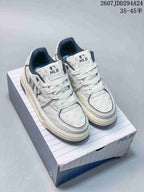 Pair of white MLB sneakers with dark padded collars and contrasting side branding displayed on a shoebox; visible overlay text includes a 35–45 size range.