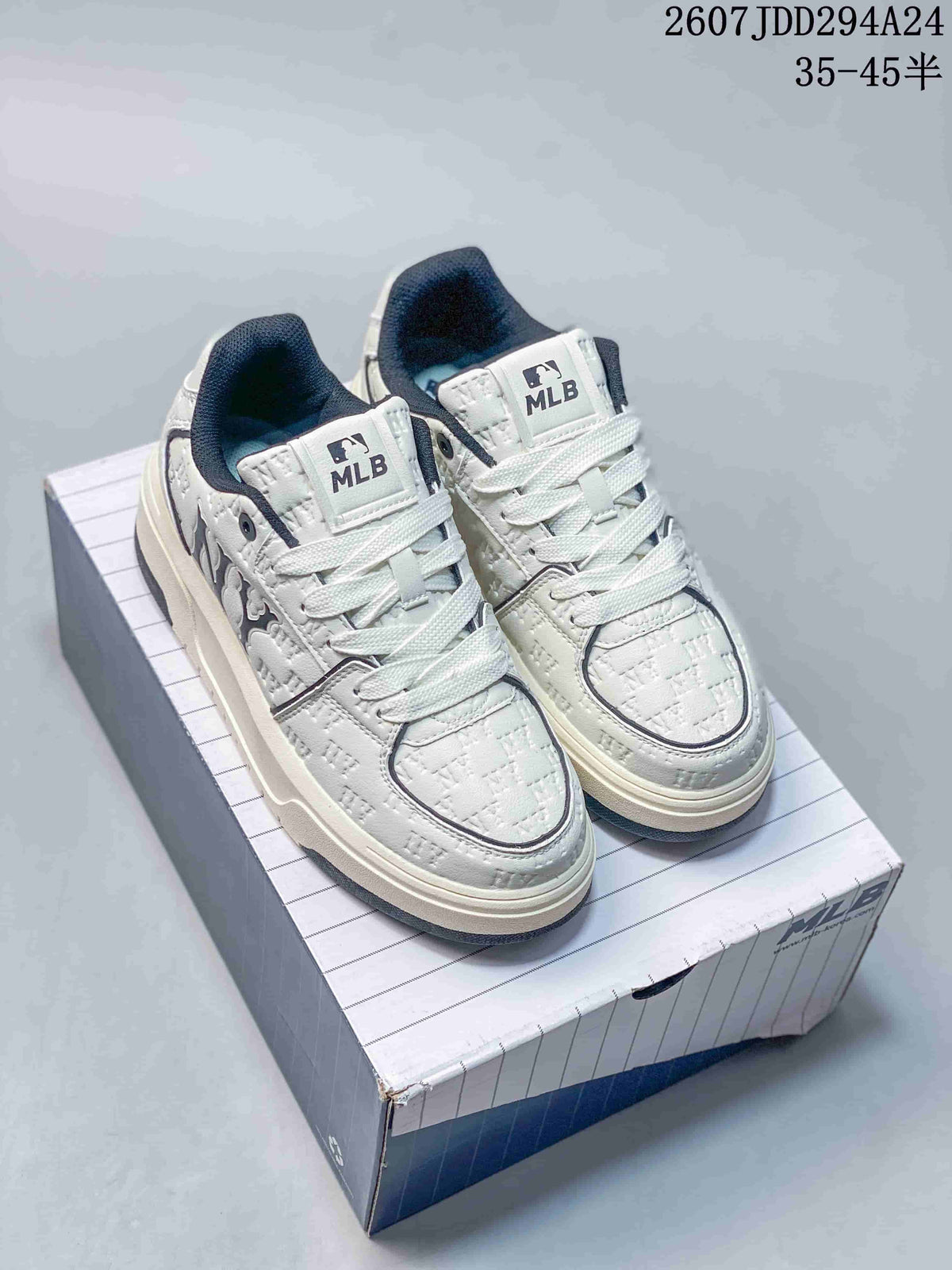 Pair of white MLB sneakers with dark padded collars and contrasting side branding displayed on a shoebox; visible overlay text includes a 35–45 size range.