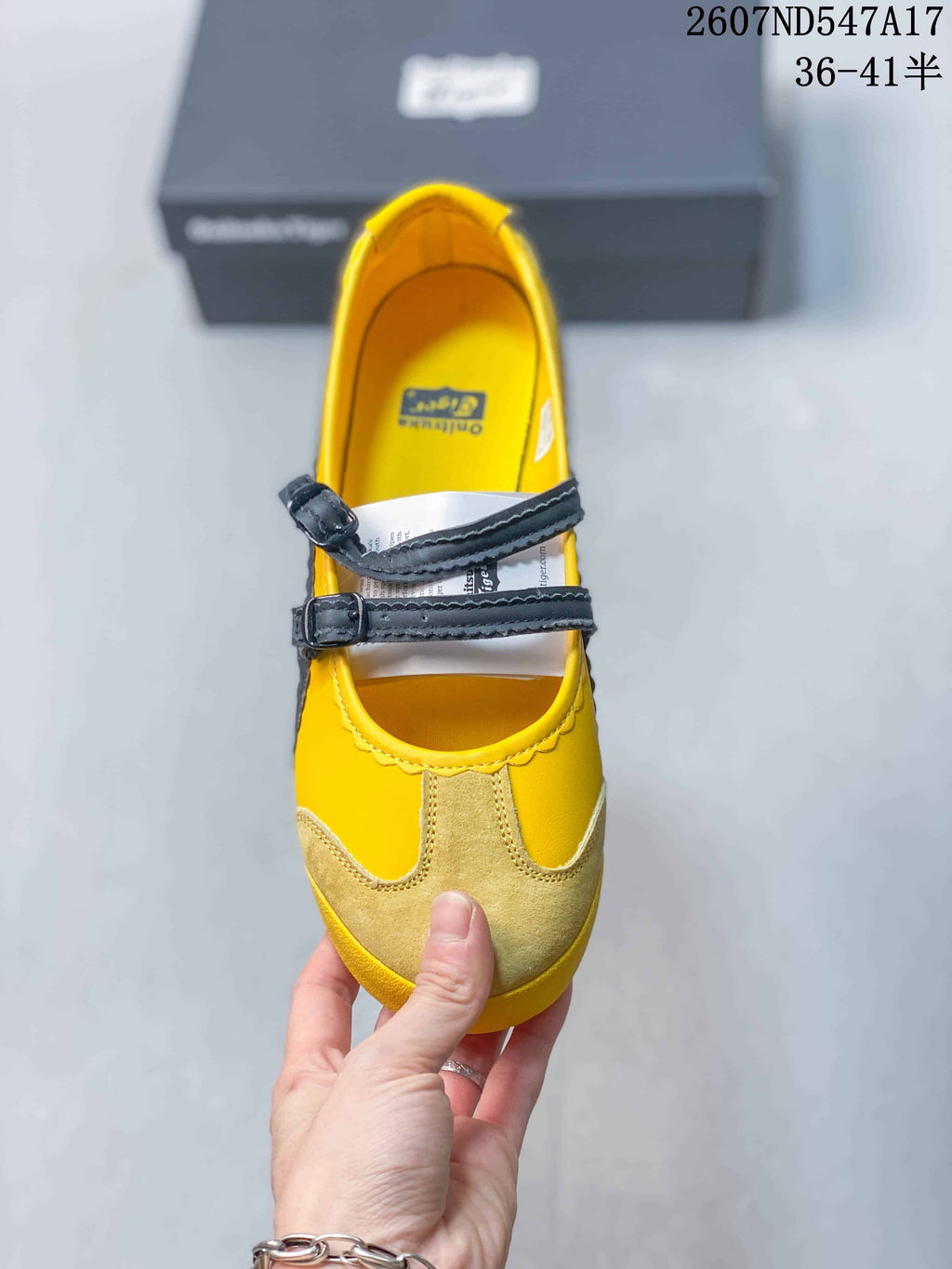 Top view showing the yellow upper, tan toe panels and two adjustable black straps.