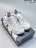 Pair of white and light-gray Adidas Holo Peak low-top trail-running shoes on a shoebox