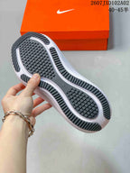 Underside of a Nike running shoe showing a black patterned outsole and white sections; image text shows 40–45.