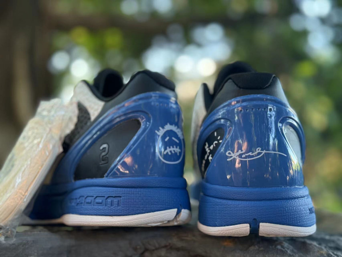 Rear detail of the blue heels with Kobe-inspired graphics and black collar accents.