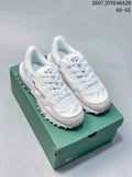 Pair of white and gray Lacoste low-top sneakers displayed on a green shoe box; image text shows style code 2607JDY646A26 and size range 40–45.