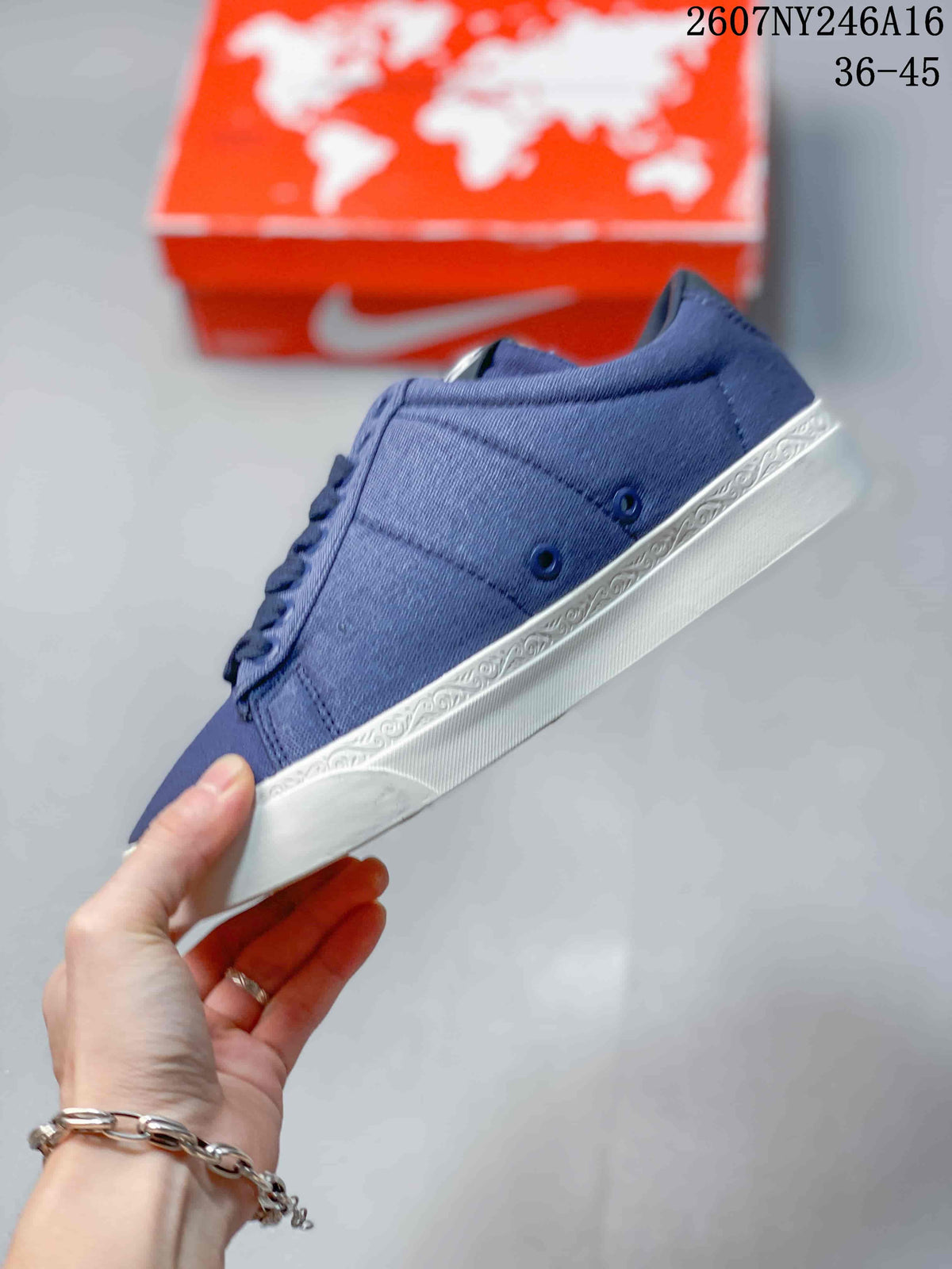 Side view of the blue low-top sneaker showing the blue upper and patterned white midsole trim.