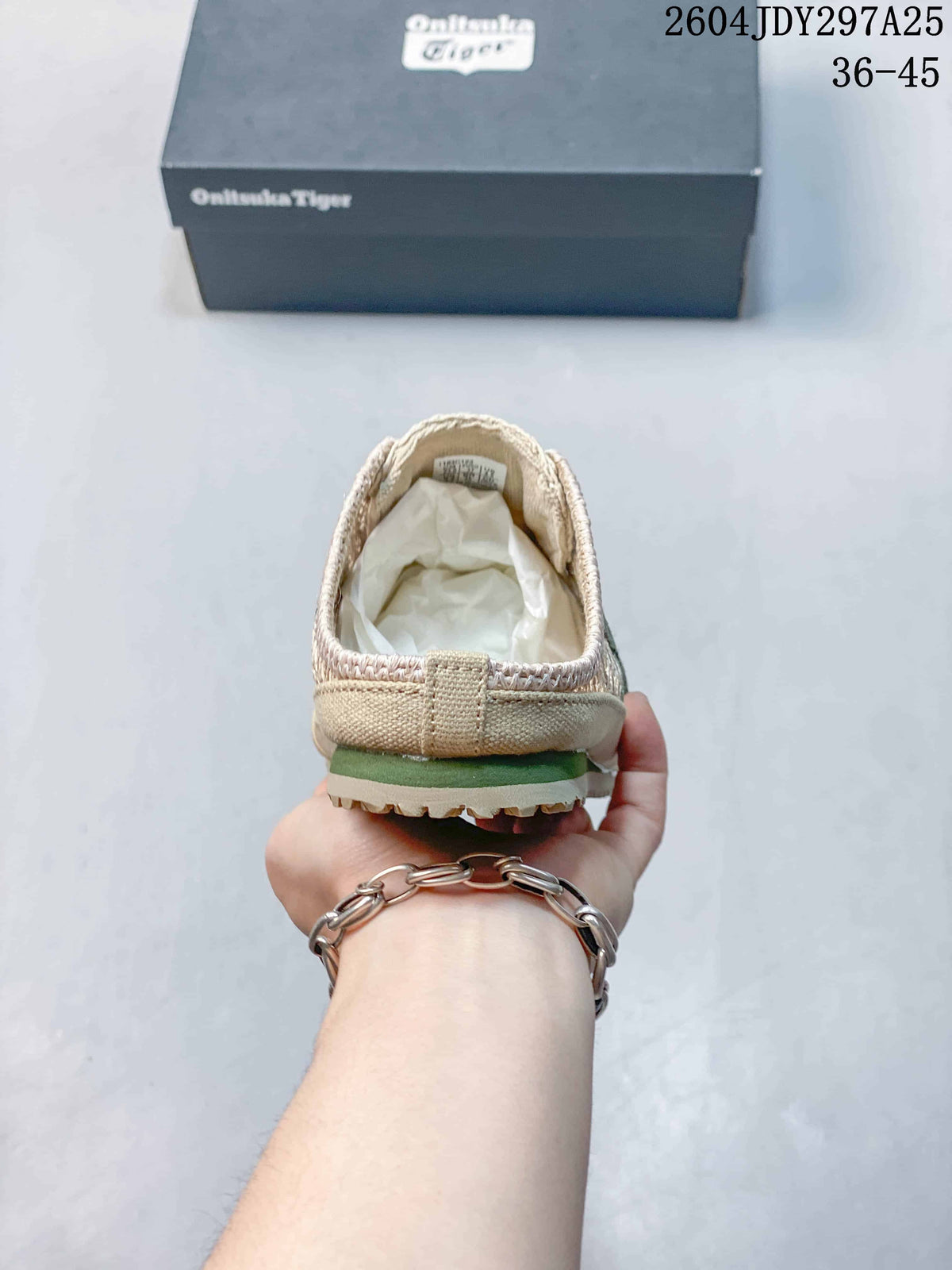 Rear view of the beige slip-on sneaker showing the heel construction and outsole edge.