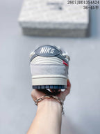 Rear view showing the padded heel collar, embroidered Nike branding, and layered heel construction.