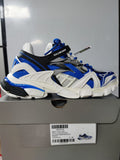 Balenciaga Track.2 open sneaker in white, royal blue and black, photographed on its shoe box with the box label visible.