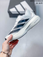 Side view of the sneaker showing layered dark navy stripes and the sculpted sole.