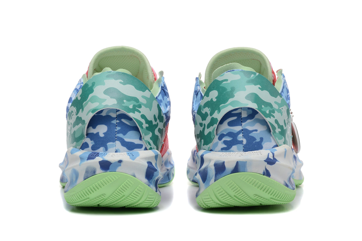 Rear view showing blue and teal camouflage panels and light green outsoles