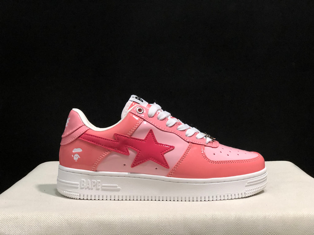 Opposite side profile showing the pink upper, BAPE side branding, star graphic, and white rubber outsole.