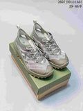 Pair of gray and olive-toned KEEN Zionic ADV low hiking shoes with bungee-style laces, shown on a shoebox.