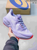 Lavender ASICS NOVABLAST 5 LE running shoe with coral outsole accents