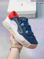 Dark sneaker with bright blue lace accents and a red lining, shown from the side.