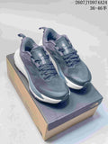 Pair of dark gray The North Face Altamesa 500 sneakers displayed on a shoebox, with white midsoles and black outsoles.