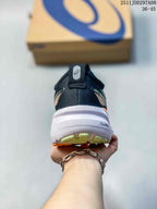 Rear view of the black running shoe showing the padded heel, ASICS branding and visible PureGEL marking on the white midsole.