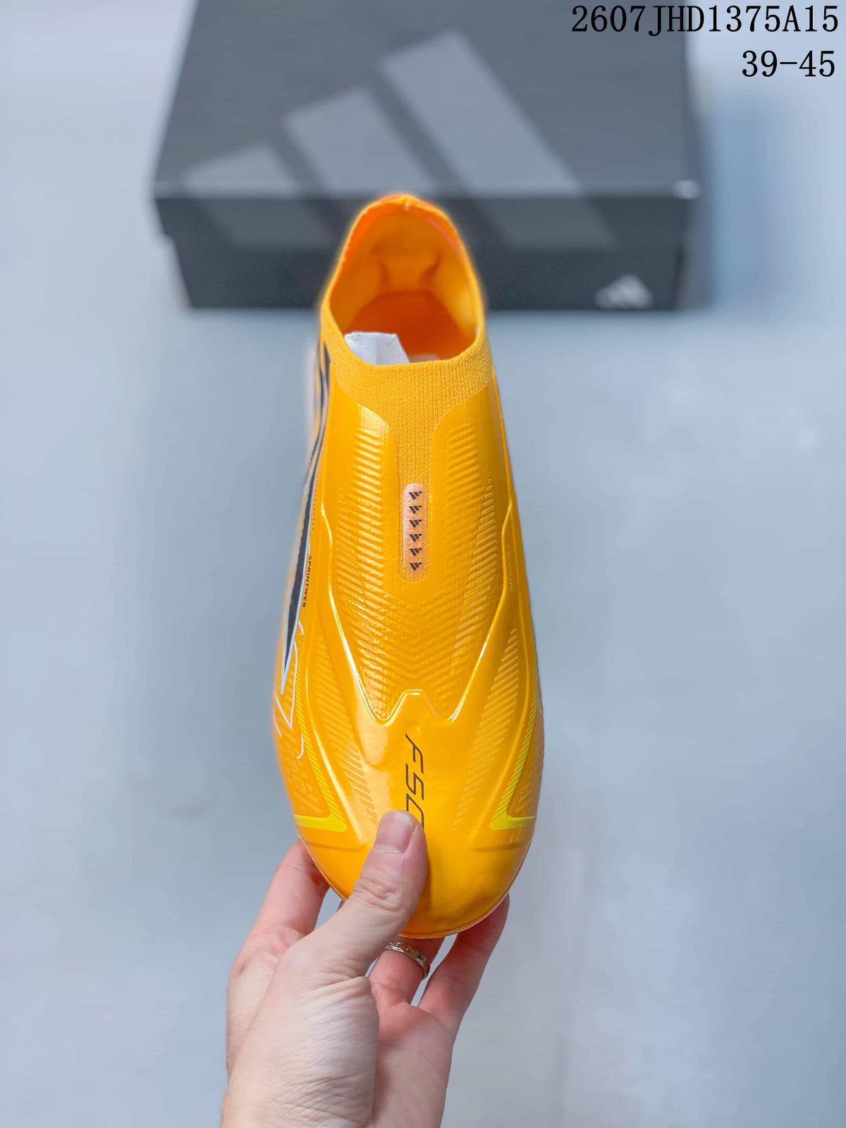 Top view showing the laceless yellow upper, textured surface detailing, and F50 branding.