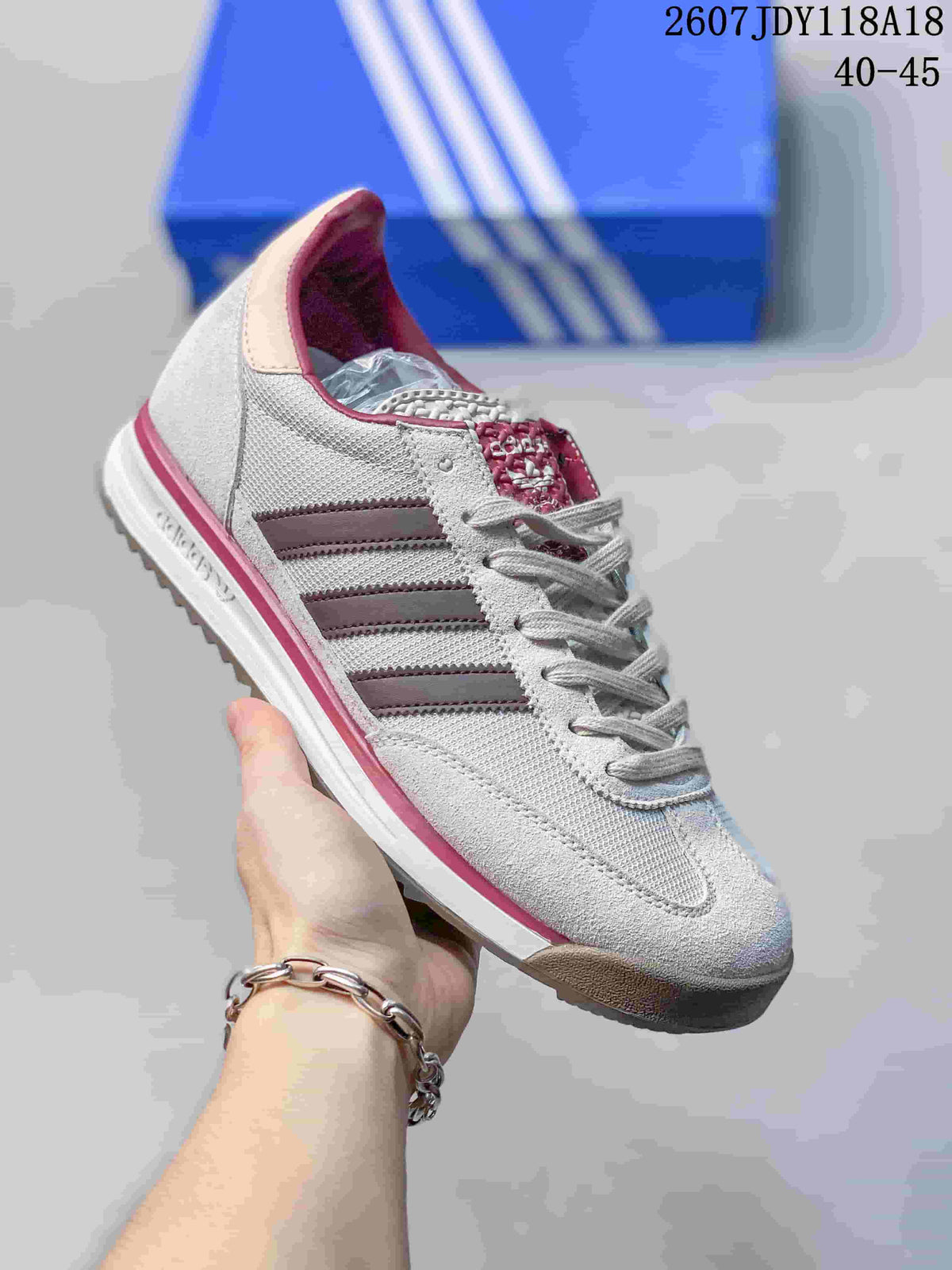 White adidas SL 72 sneaker with burgundy stripes and a pink outsole accent.