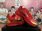 Angled view of red and gold basketball shoes