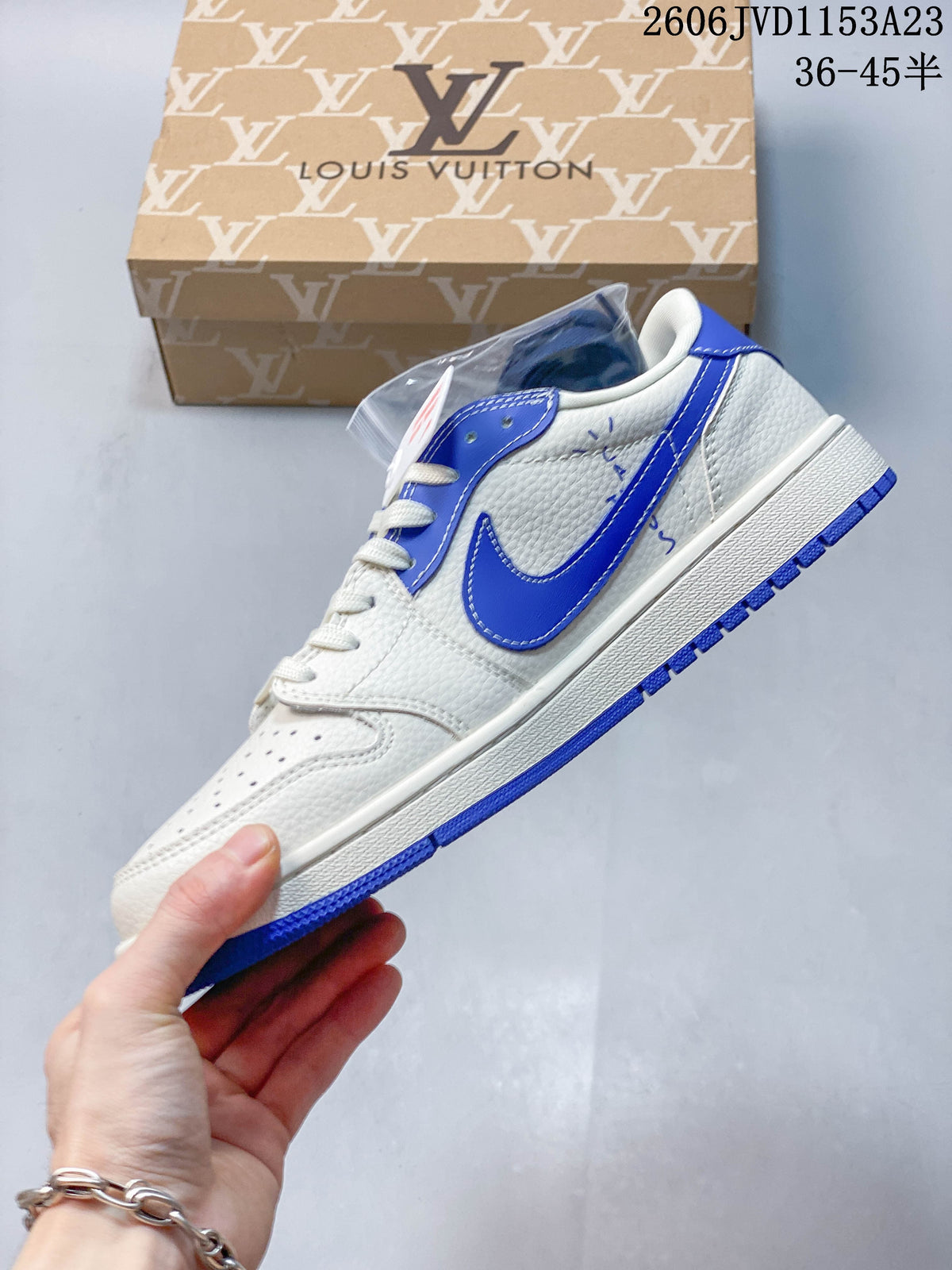 Side view of an off-white low-top sneaker with blue overlays