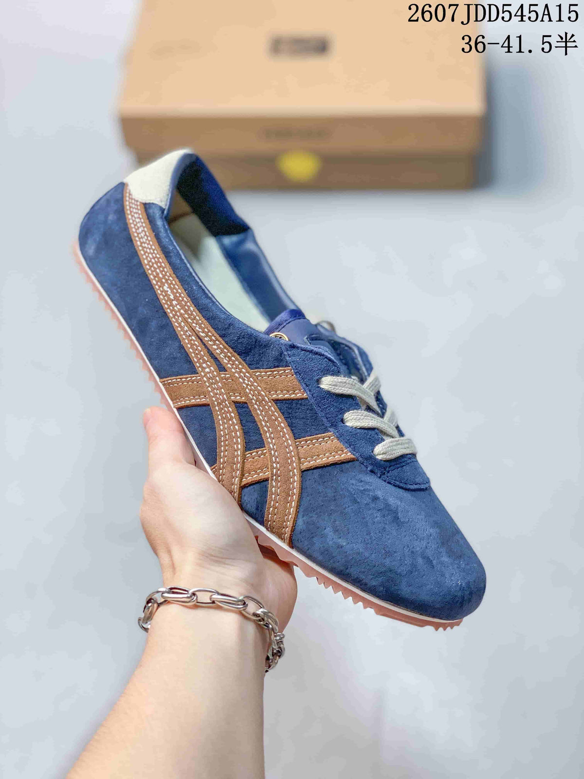 Blue low-top sneaker with brown side stripes, gray laces, and a tan textured outsole.